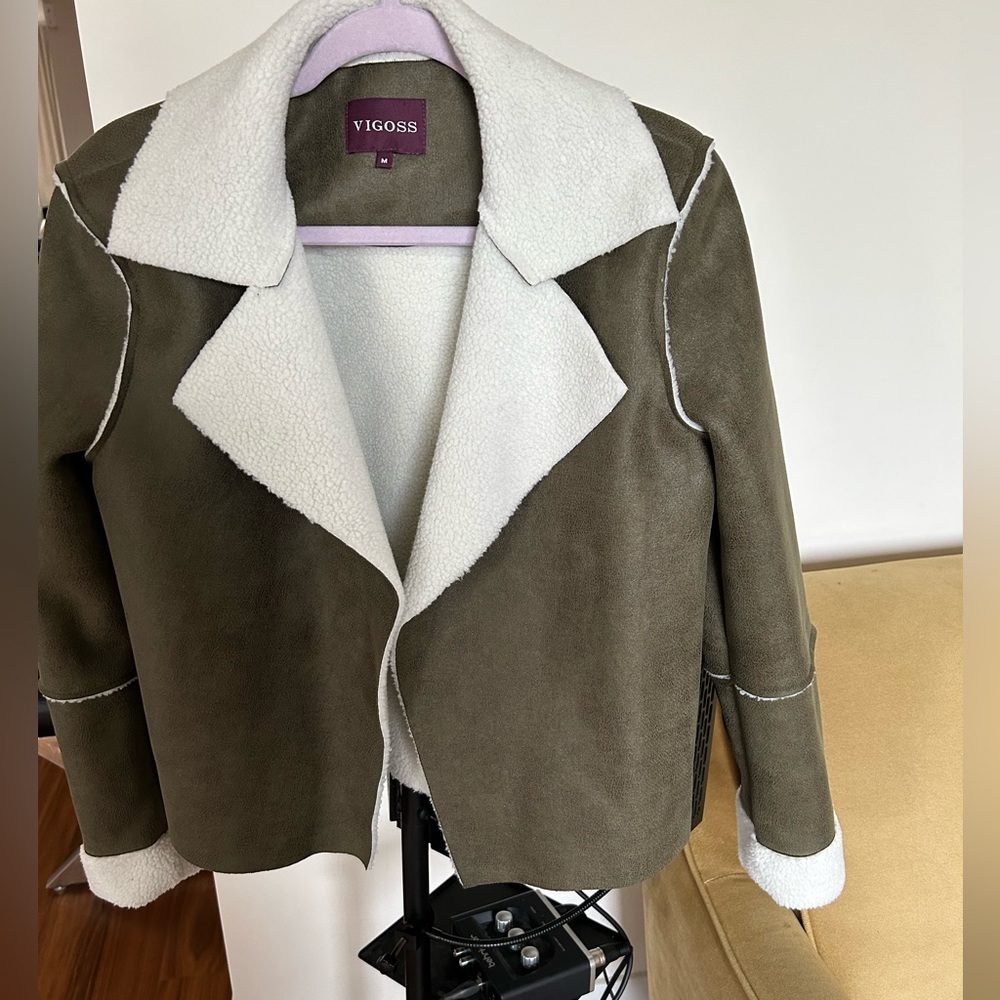 Woman’s jacket very in style, pair with jeans or a shirt size medium